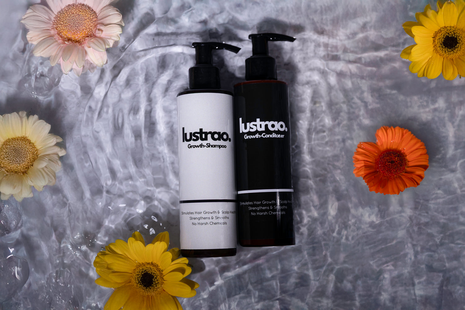 Two bottles of 'lustrao' shampoo and conditioner on a textured surface with flowers around.